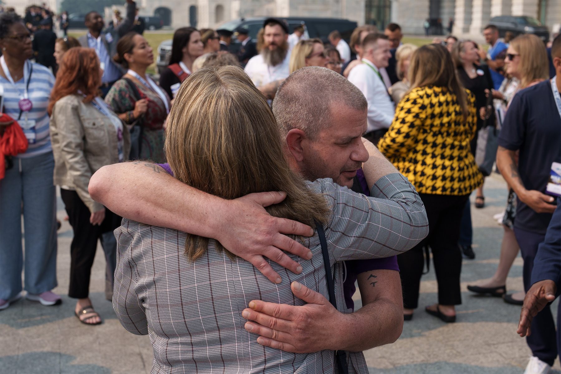 2 people hugging in a crowd, Hill Day at 2023 Recovery Leadership Summit and America Honor's Recovery Gala in Washington, D.C.